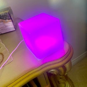 A rgb light up cube that comes with a controller to change colors+light motion